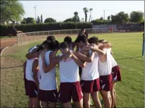  ??  ?? ABOVE: The Calexico High boys’ cross country team huddles up before a race in Calexico last season.
BELOW: Imperial High’s Camille Preece competes in an Imperial Valley League match last season in El Centro.