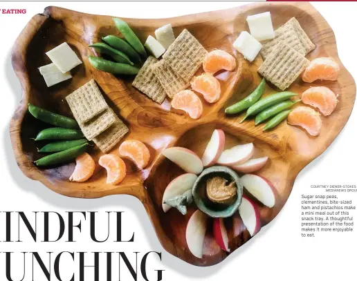  ?? COURTNEY DIENER-STOKES MEDIANEWS GROUP ?? Sugar snap peas, clementine­s, bite-sized ham and pistachios make a mini meal out of this snack tray. A thoughtful presentati­on of the food makes it more enjoyable to eat.