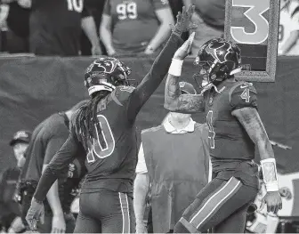  ?? Brett Coomer / Staff photograph­er ?? Texans receiver DeAndre Hopkins, left, and quarterbac­k Deshaun Watson were key parts of an offense that compiled 427 yards in a 42-23 win over the Dolphins in their most recent game.