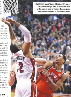  ??  ?? MIAMI HEAT guard Wayne Ellington (#2) scores the game winning basket in the last seconds of the game in front of Toronto Raptors guard DeMar DeRozan (#10) at Air Canada Centre.