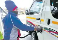  ?? ?? Nancy Sekwakwa fills up a taxi at a local fuel station in Mbombela. > Photo: Archives