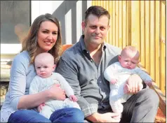  ?? Christian Abraham / Hearst Connecticu­t Media ?? Elizabeth and Chris Tillett with their twin sons, John and Luke, at right, at their home in Wilton on March 26. Chris Tillett was one of the first coronaviru­s patients reported in Connecticu­t.