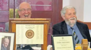  ??  ?? Laughs New president Ian Wilson shares a joke with outgoing president Bill Liggat