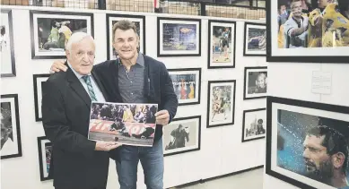  ?? My passion, my love, my life, Picture: Michel Bega ?? Former picture editor at The Citizen, Wessel Oosthuizen, left, with former Springbok wing Ray Mordt at the opening of Oosthuizen’s exhibition, titled Sport:this week. It features 138 photograph­s of significan­t sporting moments and greats, spanning 56 years. It’s at Sportpro SA/World of Rugby in Randburg for six weeks.