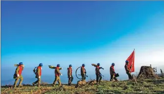  ?? CHEN XIAOLIN / FOR CHINA DAILY ?? Electricit­y workers carry out comprehens­ive maintenanc­e of power facilities and home electrical wiring and ammeters in the Qiyue Mountain region, Enshi Tujia and Miao autonomous prefecture, Central China’s Hubei province, on Dec 7, 2019.