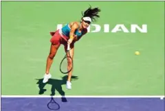  ?? AFP ?? Emma Raducanu of Great Britain serves against Petra Martic of Croatia in their third round match on Day 7 of the BNP Paribas Open at the Indian Wells Tennis Garden on Sunday.