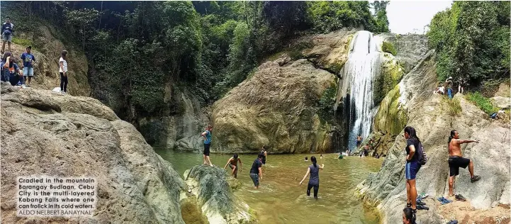  ?? ALDO NELBERT BANAYNAL ?? Cradled in the mountain Barangay Budlaan, Cebu City is the multi-layered Kabang Falls where one can frolick in its cold waters.