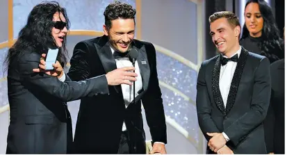  ??  ?? James Franco, center, accepts the
award for best actor in a motion
picture comedy or musical for
his role in “The Disaster Artist,” as
Tommy Wiseau (the
real life filmmaker in the movie’s
title), left, and brother Dave Franco
look on. advocate...