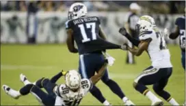  ?? MARK ZALESKI — THE ASSOCIATED PRESS ?? Then-Titans wide receiver Dorial Green-Beckham (17) is corralled by San Diego Chargers cornerback Steve Williams (23) and Chargers defensive back Dexter McCoil during a preseason game earlier this month. Green-Beckham was traded to the Eagles shortly...