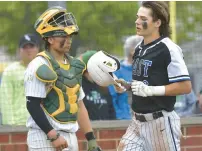  ?? JON CUNNINGHAM/DAILY SOUTHTOWN ?? Bell, right, crosses home plate after hitting a three-run homer as Providence catcher Enzo Infelise looks on during a 2023 game.