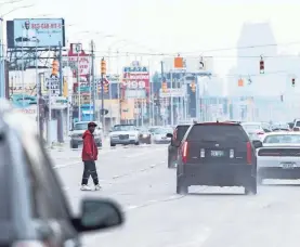  ?? JUNFU HAN/DETROIT FREE PRESS ?? On busy urban streets such as Detroit’s Gratiot Avenue, SUVs’ higher frontend profiles can make it hard to spot pedestrian­s.