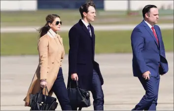  ?? Susan Walsh / Associated Press ?? Counselor to the President Hope Hicks, left, White House adviser Jared Kushner, center, and White House Social Media Director Dan Scavino, right, walk toward Air Force One at Andrews Air Force Base, Md., Wednesday.