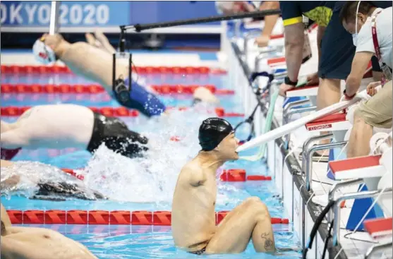  ?? CHARLY TRIBALLEAU / AFP ?? Zheng Tao competes in the men’s 50m backstroke S5 swimming heat at the Tokyo 2020 Paralympic Games on Aug 30.