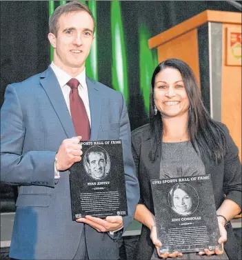  ?? UPEI/SPECIAL TO THE GUARDIAN ?? Former UPEI Panthers soccer standouts Ryan Anstey and Amy Connolly hold their plaques after being inducted into the UPEI Sport Hall of Fame Thursday in Charlottet­own.