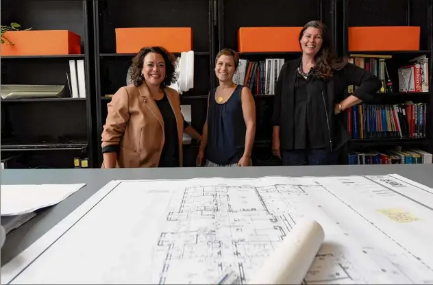  ?? Will Waldron / Times Union ?? Envision Architectu­re principals, Kelly Klopfer, business developmen­t and client relations, left, Daria Mallin president, center, and Jennifer Robillard, vice president, right, at the company offices on James Street in Albany. The trio carries forth with confidence, defying obstacles and creating meaningful work that speaks for itself.