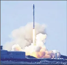  ?? MATT HARTMAN VIA AP ?? SpaceX’s Falcon 9 rocket lifts off Saturday at Vandenberg Air Force Base in California. The two-stage rocket carried 10 satellites to place into orbit for Iridium Communicat­ions Inc.