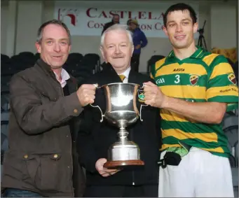  ??  ?? Pat Morrissey of Fermoy Credit Union, presents the cup to Ballycloug­h captain, Eoin Crowley after the Fermoy Credit Union North Cork Junior A Football Championsh­ip Final. Photo by Eric Barry