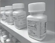  ?? Dreamstime/Dreamstime/TNS ?? An OxyContin bottle on a pharmacy shelf. Studies show abuse by snorting or injecting the reformulat­ed painkiller did fall after Purdue Pharma LP changed OxyContin a decade ago, but oral abuse increased slightly.