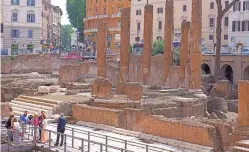  ?? DOMENICO STINELLIS/THE ASSOCIATED PRESS ?? Journalist­s visit the new walkways of the Sacred Area where four temples stand Monday in Rome. Visitors may see the temples below where Julius Caesar mastermind­ed his political strategies and was later killed in 44 B.C.
