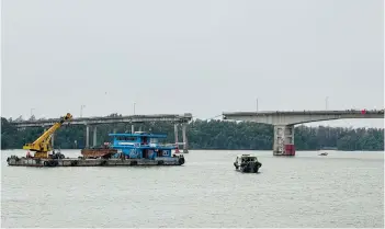  ?? — AFP photo ?? A general view shows a section of the collapsed Lixinsha bridge over a waterway in Guangzhou, in southern China’s Guangdong province.