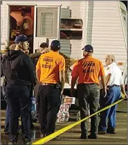  ?? (Arkansas Democrat-Gazette/Jeannie Roberts) ?? First responders gather Saturday at a command trailer in Jonesboro on the parking lot of the Mall at Turtle Creek, which was heavily damaged in Saturday’s tornado. Authoritie­s said they would likely be there for at least the next few days.