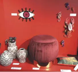  ??  ?? Bright: Red eye wall décor by Umasqu, seahorses and lobster by Studio Roof, pillow by My Friend Paco, velvet pouf stool by Greengate Europe, and vases by Asiatides