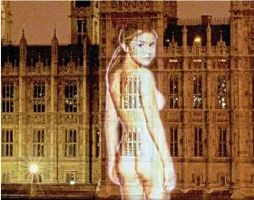  ?? ?? Exposure: Her image projected on Houses of Parliament in 1999