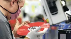  ?? Picture: David W Cerny/Reuters ?? An employee on the production line at the GZ Media vinyl record factory in Lodenice, near Prague, in the Czech Republic, this week.