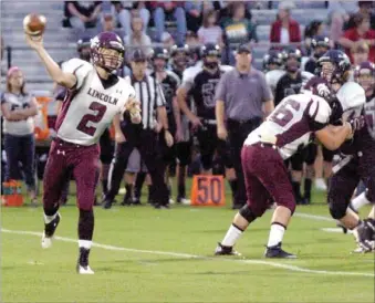  ?? MARK HUMPHREY ENTERPRISE-LEADER ?? Lincoln junior Drew Harris enjoyed solid protection in the pocket and threw for 320 yards and five touchdowns in the first half in the Wolves’ 71-0 win at Dover on Friday.