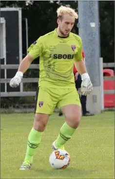  ??  ?? Corey Chambers on the ball in his farewell game for Wexford.