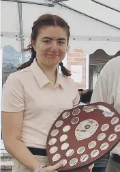  ??  ?? Charlie Pearce and Megan Chandler with the trophies from the Milton Junior Championsh­ips