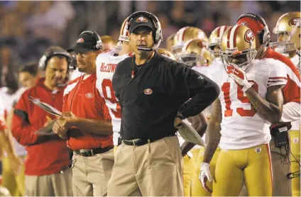  ?? Gregory Bull / Associated Press 2011 ?? Jim Harbaugh and the 49ers won two of those first three games in 2011, but the offense had little to do with their success.