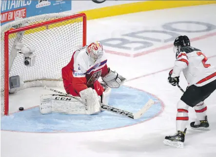  ?? PAUL CHIASSON/THE CANADIAN PRESS ?? Team Canada defenceman Blake Speers scores on Czech Republic goaltender Jakub Skarek during the second period of their world junior championsh­ip quarter-final in Montreal on Monday. Speers was set up by Mitchell Stephens, who had a three-point night.