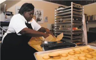  ?? Photos by Yalonda M. James / The Chronicle ?? Yvonne Hines, owner of Yvonne’s Southern Sweets in San Francisco’s Bayview neighborho­od, said she is “on cloud nine” after her shop was named a food vendor for the Warriors’ arena.