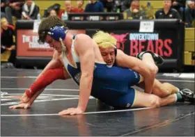  ?? AUSTIN HERTZOG - DIGITAL FIRST MEDIA ?? Spring-Ford’s Chase Smith, left, tries to fend off the takedown attempt of Boyertown’s Jacob Miller in the 182 final at the PAC Wrestling Championsh­ips Saturday at Boyertown.