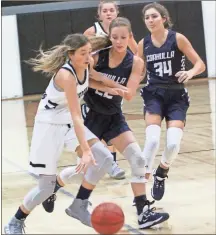  ??  ?? Gordon Lee’s Star Alexander drives the lane past Coahulla Creek’s Emma Reed during Saturday’s game at the Ridgeland Thanksgivi­ng Classic.