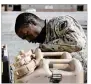  ??  ?? U.S. Army Sgt. Justin Davis, with the 35th Theater Tactical Signal Brigade, checks equipment and vehicles Tuesday before deploying to Puerto Rico. DASH COLEMAN / SAVANNAH MORNING NEWS