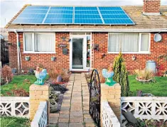  ??  ?? A bungalow fitted with rooftop solar panels on the Isle of Sheppey in Kent