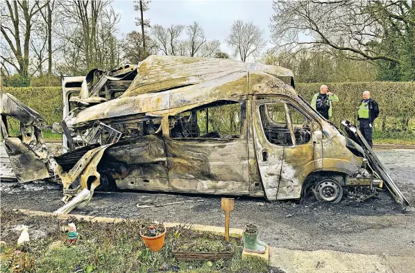  ?? ?? The burnt-out wreckage of the ambulance that exploded in Staffordsh­ire. Smoke poured from the engine as a 91-year-old patient was wheeled out, before the explosion