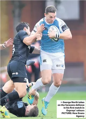  ??  ?? &gt; George North takes on the Saracens defence in his first match in Ospreys’ colours PICTURE: Huw Evans Agency