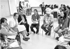  ??  ?? Jaswant (seated, fourth from left) supervisin­g one of the group discussion­s during MERCY’s seminar at Penampang library yesterday.