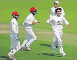  ?? GETTY IMAGES ?? Rashid Khan (right) has become the face of Afghanista­n cricket.