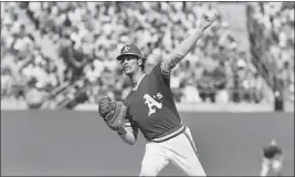  ?? THE ASSOCIATED PRESS ?? Oakland A's pitcher Ken Holtzman throws to a Mets batter during the first game of the World Series on Oct. 13, 1973, in Oakland.