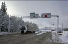  ?? DAVID KEYTON — THE ASSOCIATED PRESS ?? A truck passes the Norwegian border towards Sweden, on Friday, Feb. 8 2019. Norway’s hard border with the European Union is equipped with cameras, license-plate recognitio­n systems and barriers directing traffic to Customs officers. Norway’s membership in the European Economic Area (EEA) grants it access to the common market and most goods are exempt from paying duties but everything entering the country must be declared and cleared through customs.