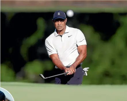  ?? AP ?? Tiger Woods, above, has joined the criticism of Phil Mickelson, left, who has withdrawn from defending his major title amid the intense backlash for his support of a Saudi-funded golf venture.