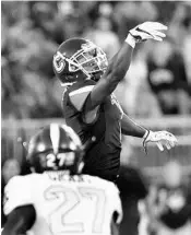  ?? STEPHEN DUNN/ASSOCIATED PRESS ?? UConn wide receiver Hergy Mayala (1) misses a pass during the Huskies’ loss to UCF on Thursday night.