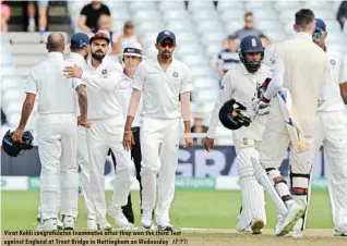  ?? AP/PTI ?? Virat Kohli congratula­tes teammates after they won the third Test against England at Trent Bridge in Nottingham on Wednesday