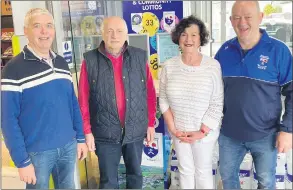  ?? ?? John Colbert receiving his cheque from Lotto committee members Adrienne Fitzgerald and Jimmy Monaghan (to the right) and Ger O’Sullivan (left) of O’Sullivan’s Centra.