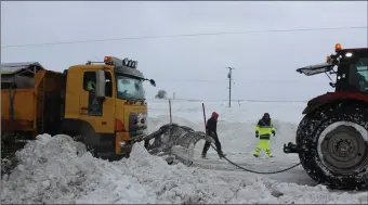  ?? Picture: Declan Monaghan ?? Even the snow plough needed a helping hand on the N2 at Koockaclev­a, Collon on Friday.