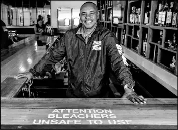  ?? L.E. Baskow Las Vegas Review-Journal @Left_Eye_Images ?? Robert Smith, the starting point guard on Jerry Tarkanian’s first UNLV Final Four team in 1977, stands behind the bar at The Hardway 8 in Henderson on May 16.